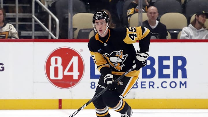 Oct 4, 2024; Pittsburgh, Pennsylvania, USA;  Pittsburgh Penguins defenseman Harrison Brunicke (45) skates with the puck against the Columbus Blue Jackets during the third period at PPG Paints Arena. Mandatory Credit: Charles LeClaire-Imagn Images