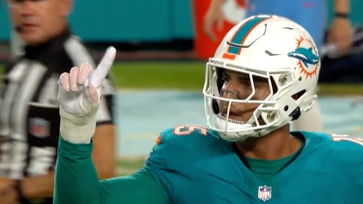 Jaelan Phillips wags his finger after knocking down a pass. 