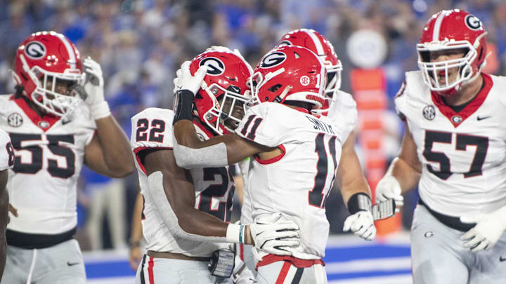 Sep 14, 2024; Lexington, Kentucky, USA; Georgia Bulldogs running back Branson Robinson (22) celebrates with wide receiver Arian Smith (11) after a touchdown in the fourth quarter against the Kentucky Wildcats at Kroger Field. Mandatory Credit: Tanner Pearson-Imagn Images
