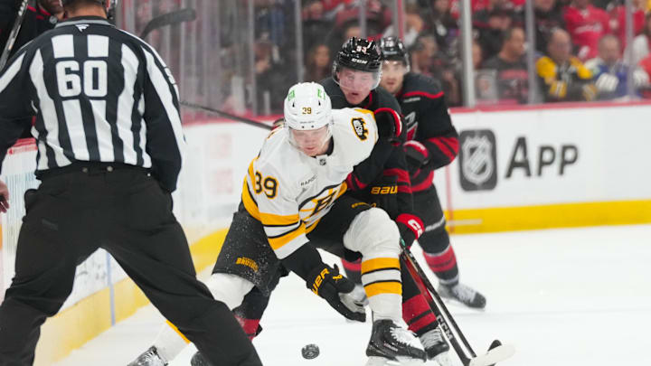 Apr 7, 2026; Raleigh, North Carolina, USA; Carolina Hurricanes right wing Jackson Blake (53) and Boston Bruins center Morgan Geekie (39) battle over the puck during the third period at Lenovo Center. Mandatory Credit: James Guillory-Imagn Images Apr 7, 2026; Raleigh, North Carolina, USA; Carolina Hurricanes right wing Jackson Blake (53) and Boston Bruins center Morgan Geekie (39) battle over the puck during the third period at Lenovo Center. Mandatory Credit: James Guillory-Imagn Images