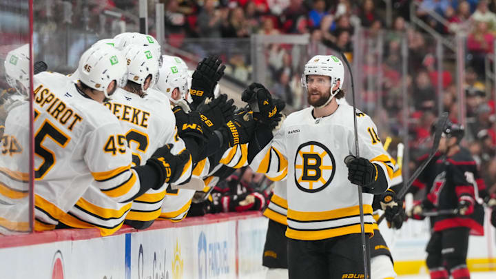 Apr 7, 2026; Raleigh, North Carolina, USA;  Boston Bruins center Pavel Zacha (18) celebrates his goal against the Carolina Hurricanes during the third period at Lenovo Center. Mandatory Credit: James Guillory-Imagn Images