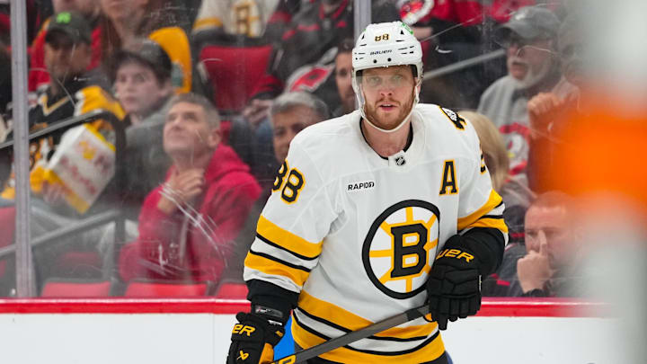 Apr 7, 2026; Raleigh, North Carolina, USA;  Boston Bruins right wing David Pastrnak (88) watches the play against the Carolina Hurricanes during the third period at Lenovo Center. Mandatory Credit: James Guillory-Imagn Images