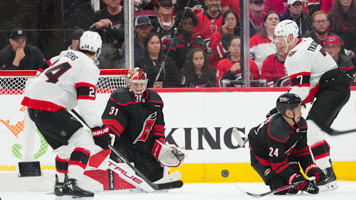 Apr 18, 2026; Raleigh, North Carolina, USA; Carolina Hurricanes center Seth Jarvis (24) with goaltender Frederik Andersen (31) go to block the shot by Ottawa Senators left wing Brady Tkachuk (7) during the third period in game one of the first round of the 2026 Stanley Cup Playoffs at Lenovo Center. Mandatory Credit: James Guillory-Imagn Images