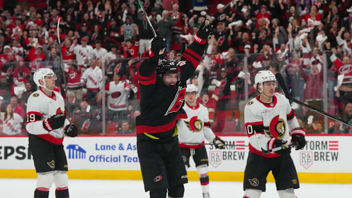Apr 20, 2026; Raleigh, North Carolina, USA; Carolina Hurricanes left wing Jordan Martinook (48) scores the game winner in the second overtime against the Ottawa Senators in game two of the first round of the 2026 Stanley Cup Playoffs at Lenovo Center. Mandatory Credit: James Guillory-Imagn Images