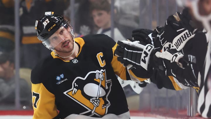 Mar 21, 2025; Pittsburgh, Pennsylvania, USA;  Pittsburgh Penguins center Sidney Crosby (87) celebrates his goal  with the Penguins bench against the Columbus Blue Jackets during the second period at PPG Paints Arena. Mandatory Credit: Charles LeClaire-Imagn Images