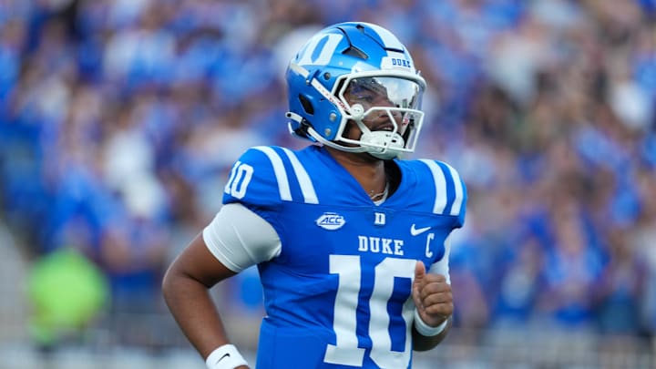 Aug 28, 2025; Durham, North Carolina, USA;  Duke Blue Devils quarterback Darian Mensah (10) comes running out onto the field before the start of the game against the Elon Phoenix at Wallace Wade Stadium. Mandatory Credit: James Guillory-Imagn Images