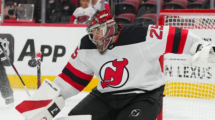 Oct 9, 2025; Raleigh, North Carolina, USA;  New Jersey Devils goaltender Jacob Markstrom (25) stops the shot against the Carolina Hurricanes during the during the third period at Lenovo Center. Mandatory Credit: James Guillory-Imagn Images