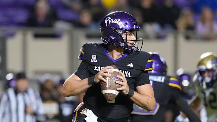 Greenville, North Carolina, USA; East Carolina Pirates quarterback Katin Houser (4) rolls out of the pocket against the Tulsa Golden Hurricane during the first half at Dowdy-Ficklen Stadium. Greenville, North Carolina, USA; East Carolina Pirates quarterback Katin Houser (4) rolls out of the pocket against the Tulsa Golden Hurricane during the first half at Dowdy-Ficklen Stadium.