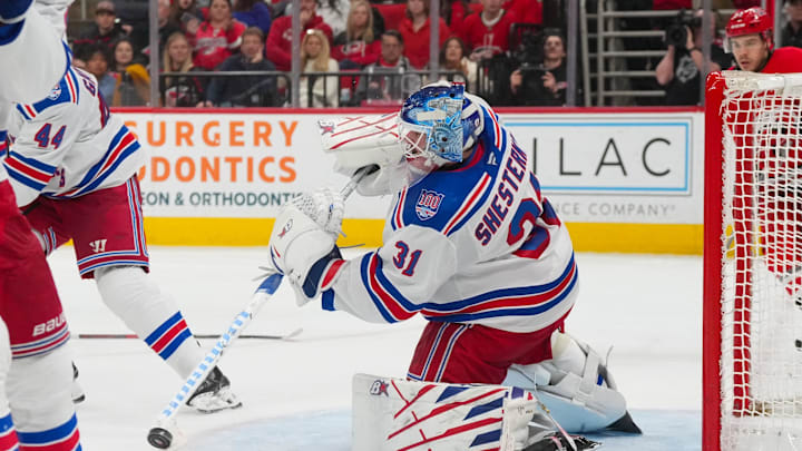 Dec 29, 2025; Raleigh, North Carolina, USA;  New York Rangers goaltender Igor Shesterkin (31) clears the puck away against the Carolina Hurricanes during the third period at Lenovo Center. Mandatory Credit: James Guillory-Imagn Images