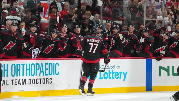 Oct 13, 2026; Raleigh, North Carolina, USA; Carolina Hurricanes left wing Mark Jankowski (77) celebrates his empty net goal against the Washington Capitals during the third period at Lenovo Center.  Mandatory Credit: James Guillory-Imagn Images