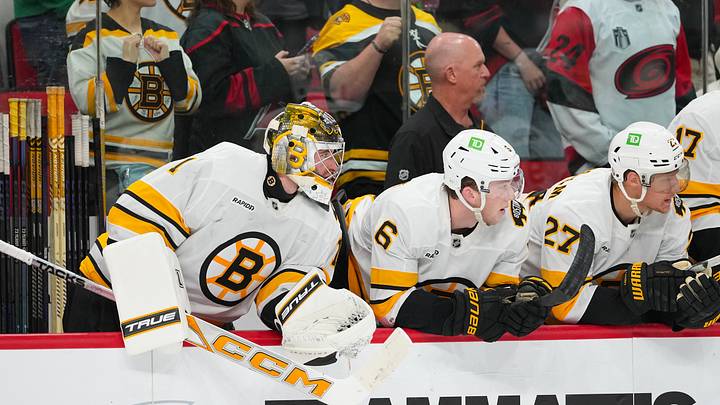 Oct 27, 2026; Raleigh, North Carolina, USA; Boston Bruins goaltender Jeremy Swayman (1) defenseman Mason Lohrei (6) and defenseman Hampus Lindholm (27) look on from the players bench against the Carolina Hurricanes during the third period at Lenovo Center. Mandatory Credit: James Guillory-Imagn Images Oct 27, 2026; Raleigh, North Carolina, USA; Boston Bruins goaltender Jeremy Swayman (1) defenseman Mason Lohrei (6) and defenseman Hampus Lindholm (27) look on from the players bench against the Carolina Hurricanes during the third period at Lenovo Center. Mandatory Credit: James Guillory-Imagn Images