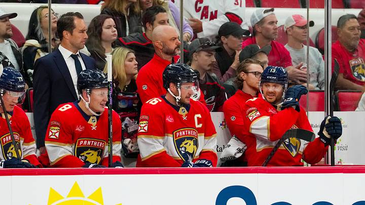 Sep 22, 2026; Raleigh, North Carolina, USA; Florida Panthers left wing Brady Tkachuk (8), center Aleksander Barkov (16), and center Sam Reinhart (13) look on from the players bench against the Carolina Hurricanes during the first period t Lenovo Center. Mandatory Credit: James Guillory-Imagn Images Sep 22, 2026; Raleigh, North Carolina, USA; Florida Panthers left wing Brady Tkachuk (8), center Aleksander Barkov (16), and center Sam Reinhart (13) look on from the players bench against the Carolina Hurricanes during the first period t Lenovo Center. Mandatory Credit: James Guillory-Imagn Images