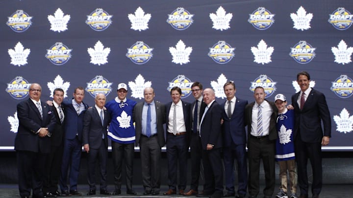 Jun 24, 2016; Buffalo, NY, USA; Auston Matthews poses for a photo with team officials after being selected as the number one overall draft pick by the Toronto Maple Leafs in the first round of the 2016 NHL Draft at the First Niagra Center. Mandatory Credit: Timothy T. Ludwig-Imagn Images