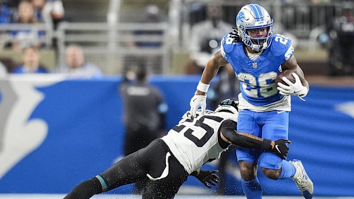Nov 17, 2024; Detroit, MI, USA; Detroit Lions running back Jahmyr Gibbs (26) runs against Jacksonville Jaguars cornerback Ronald Darby (25) during the first half at Ford Field in Detroit on Sunday, Nov. 17, 2024. Mandatory Credit: Junfu Han/USA TODAY Network via Imagn Images 