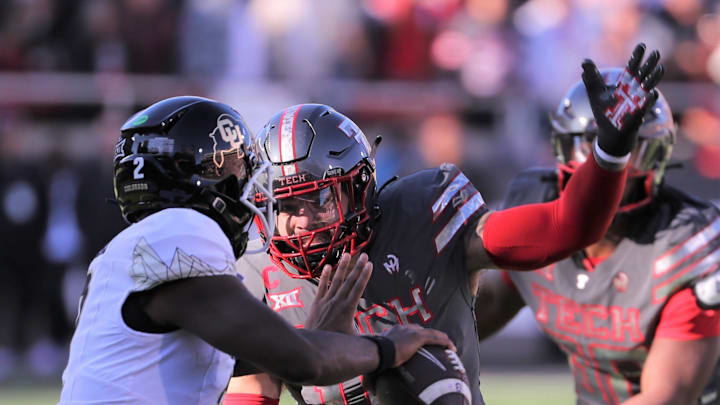 Texas Tech's Jacob Rodriguez rushes Colorado quarterback Shedeur Sanders.