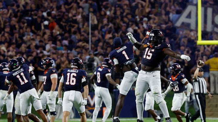 Sep 26, 2025; Charlottesville, Virginia, USA; Virginia Cavaliers defensive lineman Hunter Osborne (15) Cavaliers wide receiver Suderian Harrison (1) celebrate after making a stop on a fourth down against the Florida State Seminoles during the fourth quarter at Scott Stadium. Mandatory Credit: Geoff Burke-Imagn Images Sep 26, 2025; Charlottesville, Virginia, USA; Virginia Cavaliers defensive lineman Hunter Osborne (15) Cavaliers wide receiver Suderian Harrison (1) celebrate after making a stop on a fourth down against the Florida State Seminoles during the fourth quarter at Scott Stadium. Mandatory Credit: Geoff Burke-Imagn Images