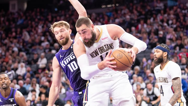 Jan 7, 2024; Sacramento, California, USA; New Orleans Pelicans center Jonas Valanciunas (17) grabs a rebound against Sacramento Kings forward Domantas Sabonis (10) during the second quarter at Golden 1 Center. Mandatory Credit: Ed Szczepanski-Imagn Images