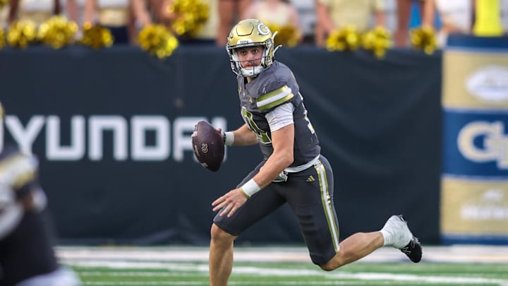 Sep 20, 2025; Atlanta, Georgia, USA; Georgia Tech Yellow Jackets quarterback Haynes King (10) scrambles against the Temple Owls in the third quarter at Bobby Dodd Stadium at Hyundai Field. Mandatory Credit: Brett Davis-Imagn Images