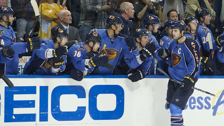 Mar 27, 2011; Atlanta, GA, USA;   Atlanta Thrashers left wing Andrew Ladd (C) shakes hands with teammates on the bench after scoring the winning goal in the shootout against the Ottawa Senators at Philips Arena. The Thrashers defeated the Senators 5-4 in a shootout. Mandatory Credit: Dale Zanine-Imagn Images