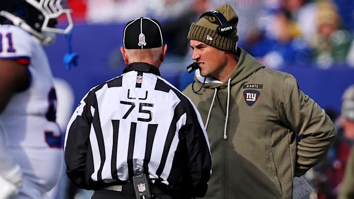 Nov 16, 2025; East Rutherford, New Jersey, USA; New York Giants interim Mike Kafka talks to line judge Mark Stewart (75) during the first quarter against the Green Bay Packers at MetLife Stadium. Mandatory Credit: Vincent Carchietta-Imagn Images