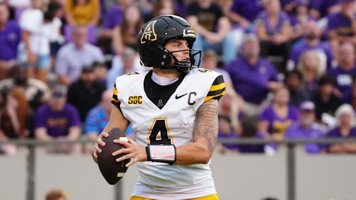 Sep 14, 2024; Greenville, North Carolina, USA;  Appalachian State Mountaineers quarterback Joey Aguilar (4) looks down field against the East Carolina Pirates during the second half at Dowdy-Ficklen Stadium. Mandatory Credit: James Guillory-Imagn Images