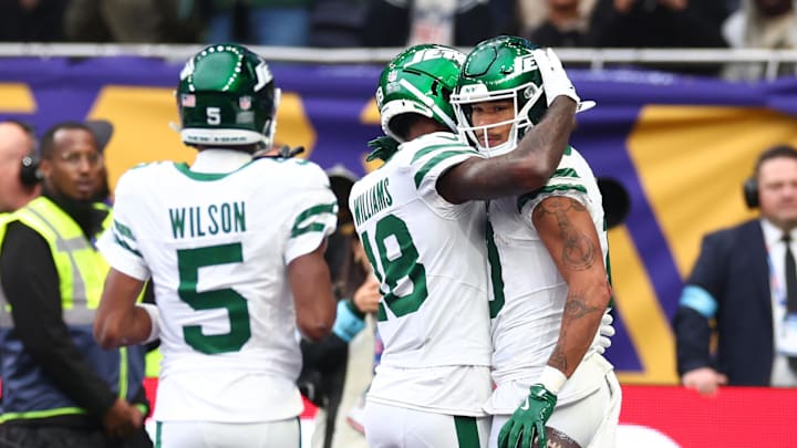 Oct 6, 2024; Tottenham, ENG; New York Jets Wide Receiver Allen Lazard (10) celebrates with Wide Receiver Mike Williams (18) after he scores a touch down for 6-17 in the 2nd Quarter against Minnesota Vikings at Tottenham Hotspur Stadium. Mandatory Credit: Shaun Brooks-Imagn Images