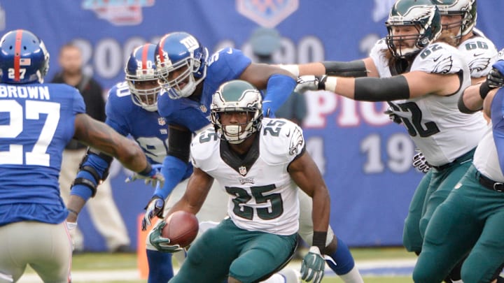 Dec 28, 2014; East Rutherford, NJ, USA; Philadelphia Eagles running back LeSean McCoy (25) runs with the ball against the New York Giants in the first quarter during the game at MetLife Stadium. Mandatory Credit: Robert Deutsch-Imagn Images