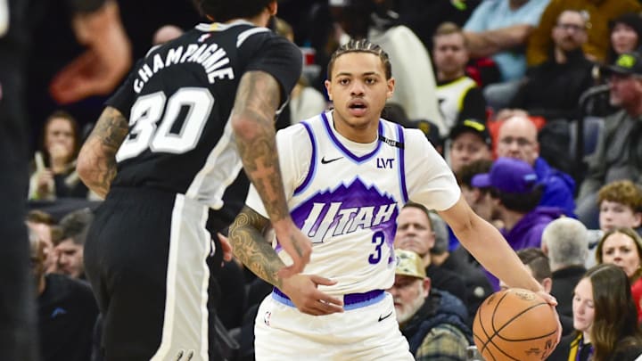 Jan 22, 2026; Salt Lake City, Utah, USA; Utah Jazz guard Keyonte George (3) dribbles against San Antonio Spurs forward Julian Champagnie (30) during the second half at Delta Center. Mandatory Credit: Peter Creveling-Imagn Images