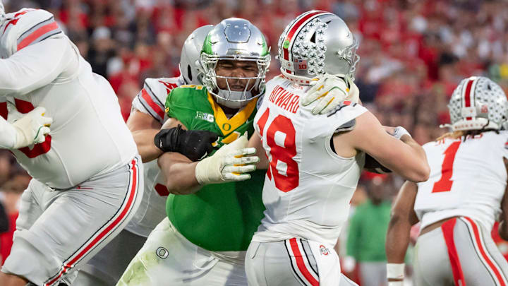 Oregon defensive lineman Derrick Harmon sacks Ohio State quarterback Will Howard.