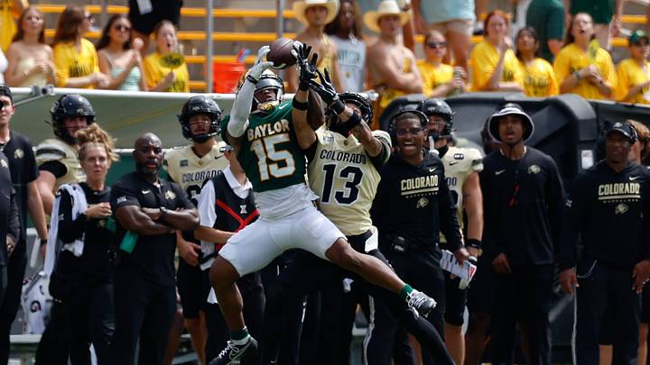Sep 26, 2026; Waco, Texas, USA; Baylor Bears wide receiver Jayden McGowan (15) makes a catch as Colorado Buffaloes defensive back Jason Stokes Jr. (13) defends during the second half at McLane Stadium. Mandatory Credit: Chris Jones-Imagn Images Sep 26, 2026; Waco, Texas, USA; Baylor Bears wide receiver Jayden McGowan (15) makes a catch as Colorado Buffaloes defensive back Jason Stokes Jr. (13) defends during the second half at McLane Stadium. Mandatory Credit: Chris Jones-Imagn Images
