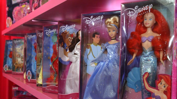 An assortment of Disney cartoon character dolls are displayed during the Walt Disney Company  press conference introducing the Disney Princess franchise