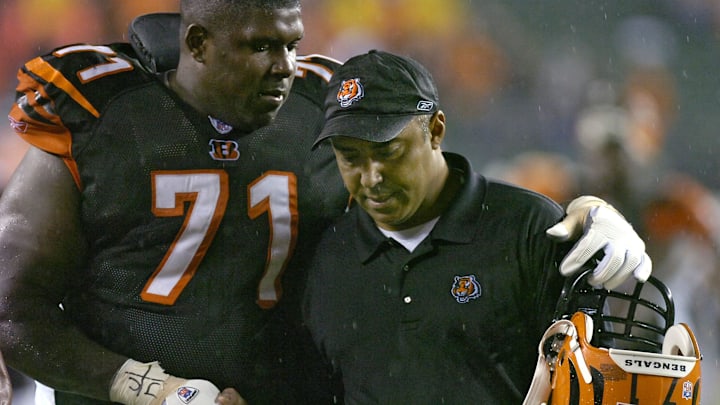 THURSDAY NOVEMBER 30, 2006  BENGALS  SPORTS
Willie Anderson, who challenged the Bengals fans prior to the game, walks off the field with his arm around head coach Marvin Lewis after the win. The Cincinnati Bengals beat the AFC Central Division leading Baltimore Ravens 13-7 at Paul Brown Stadium.   The Enquirer/Jeff Swinger

Marvinfn 1201 Jpg