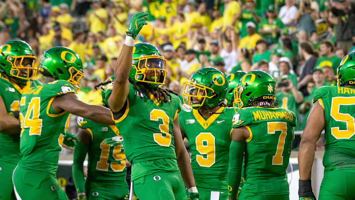 Oregon Ducks defensive back Brandon Johnson and fellow members of the Oregon defense celebrate an interception as the Oregon Ducks host the Idaho Vandals Saturday, Aug. 31, 2024 at Autzen Stadium in Eugene, Ore.