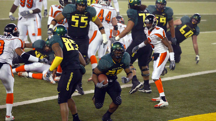 November 19, 2005; Eugene, OR USA; Oregon Ducks running back Jonathon Stewart (28) scores a touchdown to put the Ducks up 28-7 on the Oregon State Beavers during the second quarter at Autzen Stadium in Eugene, Oregon. Mandatory Credit: Photo by Craig Mitchelldyer-Imagn Images (c) 2005 by Craig Mitchelldyer November 19, 2005; Eugene, OR USA; Oregon Ducks running back Jonathon Stewart (28) scores a touchdown to put the Ducks up 28-7 on the Oregon State Beavers during the second quarter at Autzen Stadium in Eugene, Oregon. Mandatory Credit: Photo by Craig Mitchelldyer-Imagn Images (c) 2005 by Craig Mitchelldyer