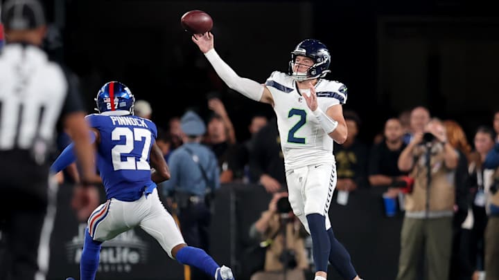 Oct 2, 2023; East Rutherford, New Jersey, USA; Seattle Seahawks quarterback Drew Lock (2) throws a pass against New York Giants safety Jason Pinnock (27) during the second quarter at MetLife Stadium. Mandatory Credit: Brad Penner-USA TODAY Sports