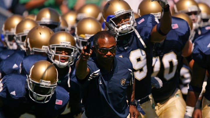 Sep 6, 2003; South Bend, IN, USA; FILE PHOTO: Notre Dame head football coach Tyrone Willingham leads his team onto the field at Notre Dame Stadium before the 2003 season opener against Washington State.  Notre Dame athletic director Kevin White announced Tuesday Nov. 30, 2004 that Tyrone Willingham would not be retained as head coach at Notre Dame. Mandatory Credit: Photo By Matt Cashore-Imagn Images Copyright (c) 2004 Matt Cashore