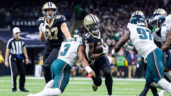 Sep 22, 2024; New Orleans, Louisiana, USA; New Orleans Saints running back Alvin Kamara (41) is tackled by Philadelphia Eagles linebacker Nolan Smith Jr. (3) during the first half at Caesars Superdome. Mandatory Credit: Stephen Lew-Imagn Images