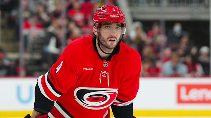 Nov 29, 2024; Raleigh, North Carolina, USA;  Carolina Hurricanes defenseman Shayne Gostisbehere (4) looks on against the Florida Panthers during the first period at Lenovo Center. Mandatory Credit: James Guillory-Imagn Images