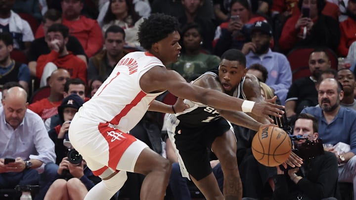 Oct 17, 2024; Houston, Texas, USA; San Antonio Spurs guard Blake Wesley (14) looks to pass against Houston Rockets forward Amen Thompson (1) in the third quarter at Toyota Center. Mandatory Credit: Thomas Shea-Imagn Images