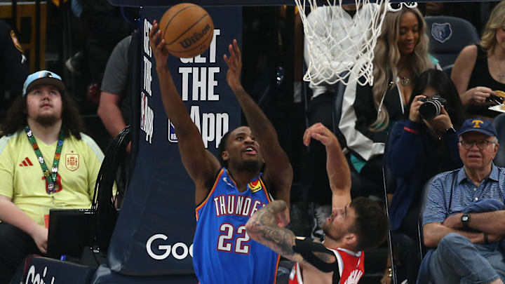 Apr 26, 2025; Memphis, Tennessee, USA; Oklahoma City Thunder guard Cason Wallace (22) shoots as Memphis Grizzlies guard John Konchar (46) defends during the first quarter during game four for the first round of the 2024 NBA Playoffs at FedExForum. Mandatory Credit: Petre Thomas-Imagn Images