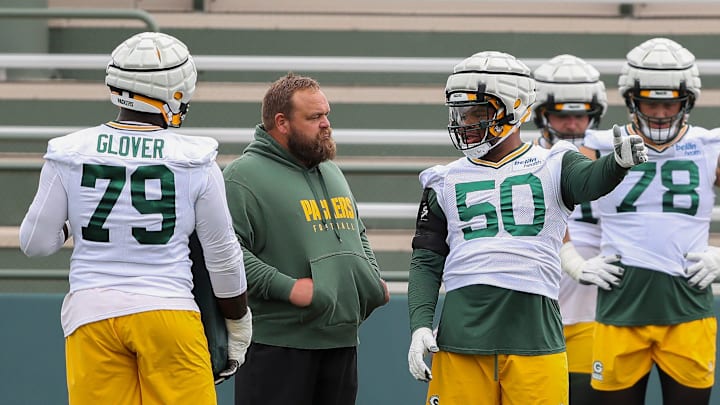 Green Bay Packers offensive lineman Zach Tom (50) talks with offensive line coach Luke Butkus between drill reps during practice on Thursday, August 8, 2024, at Ray Nitschke Field in Ashwaubenon, Wis. 
Tork Mason/USA TODAY NETWORK-Wisconsin