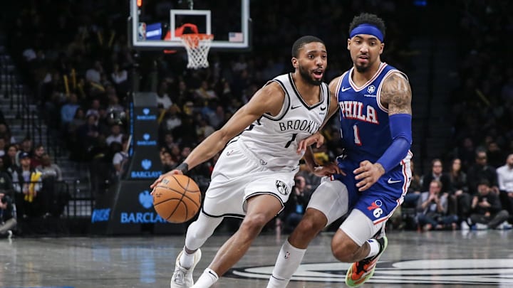 Mar 5, 2024; Brooklyn, New York, USA;  Brooklyn Nets forward Mikal Bridges (1) looks to drive past Philadelphia 76ers forward KJ Martin (1) in the fourth quarter at Barclays Center. Mandatory Credit: Wendell Cruz-USA TODAY Sports