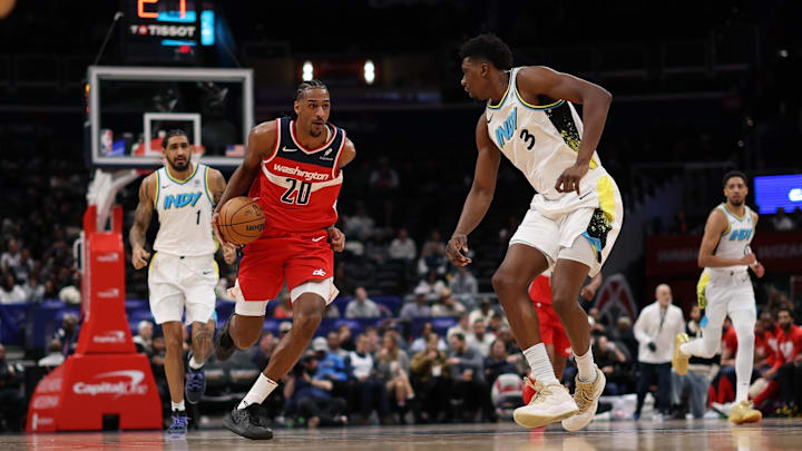 Feb 12, 2025; Washington, District of Columbia, USA; Washington Wizards forward Alex Sarr (20) drives to the basket as Indiana Pacers center Thomas Bryant (3) defends in the second quarter at Capital One Arena. Mandatory Credit: Geoff Burke-Imagn Images