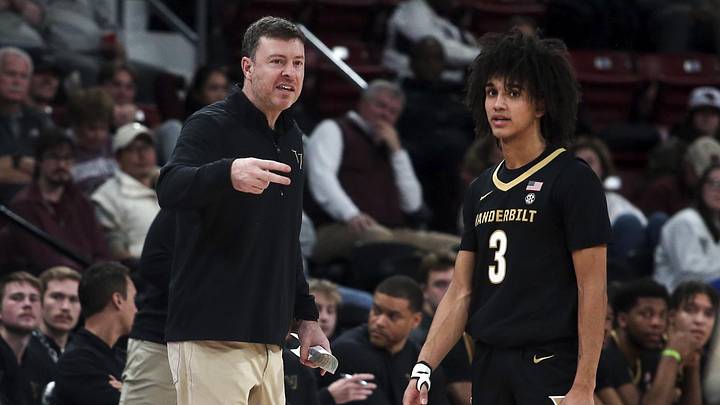 Jan 24, 2026; Starkville, Mississippi, USA; Vanderbilt Commodores head coach Mark Byington talks with guard Tyler Tanner (3) during the first half against Mississippi State at Humphrey Coliseum. Mandatory Credit: Petre Thomas-Imagn Images