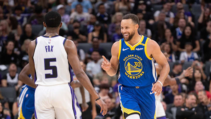 Oct 9, 2024; Sacramento, California, USA; Golden State Warriors guard Stephen Curry (30) motions to Sacramento Kings guard De'Aaron Fox (5) after scoring during the second quarter at Golden 1 Center. Mandatory Credit: Ed Szczepanski-Imagn Images Oct 9, 2024; Sacramento, California, USA; Golden State Warriors guard Stephen Curry (30) motions to Sacramento Kings guard De'Aaron Fox (5) after scoring during the second quarter at Golden 1 Center. Mandatory Credit: Ed Szczepanski-Imagn Images