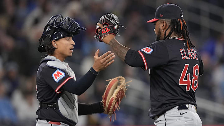 May 4, 2025; Toronto, Ontario, CAN; Cleveland Guardians pitcher Emmanuel Clase (48) and catcher Bo Naylor (23) celebrate a win over the Toronto Blue Jays at Rogers Centre. Mandatory Credit: John E. Sokolowski-Imagn Images