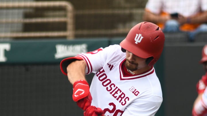 Indiana's Nick Mitchell (20) hits the ball during a NCAA Baseball Tournament Knoxville Regional game at Lindsey Nelson Stadium on Sunday, June 2, 2024 in Knoxville, Tenn.