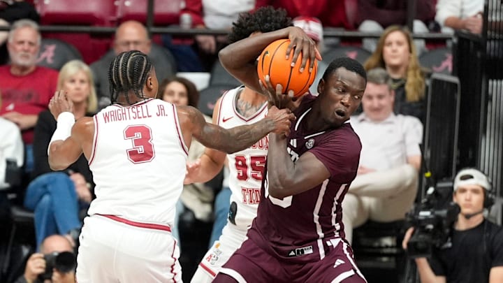 Feb 25, 2026; Tuscaloosa, AL, USA; Alabama guard Latrell Wrightsell Jr. (3) and Alabama guard Houston Mallette (95) defend Mississippi State forward Achor Achor (99) as he works for a shot in the lane at Coleman Coliseum. Alabama defeated Mississippi State 100-75. Mandatory Credit: Gary Cosby Jr.-Tuscaloosa News
