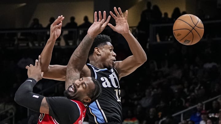 Feb 12, 2024; Atlanta, Georgia, USA; Chicago Bulls center Andre Drummond (3) knocks the ball out of