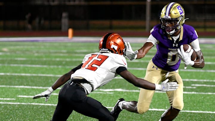 Booker's defensive back/wide receiver Chauncey Kennon (#0) puts the stiff arm to Lely's wide receiver, Dwayne Liberal (#12). The Booker Tornadoes hosted the Lely Trojans (Naples, FL) Friday night, Aug. 23, 2024, who lost to Booker 46-0 during the first regular non-conference season game of the year.